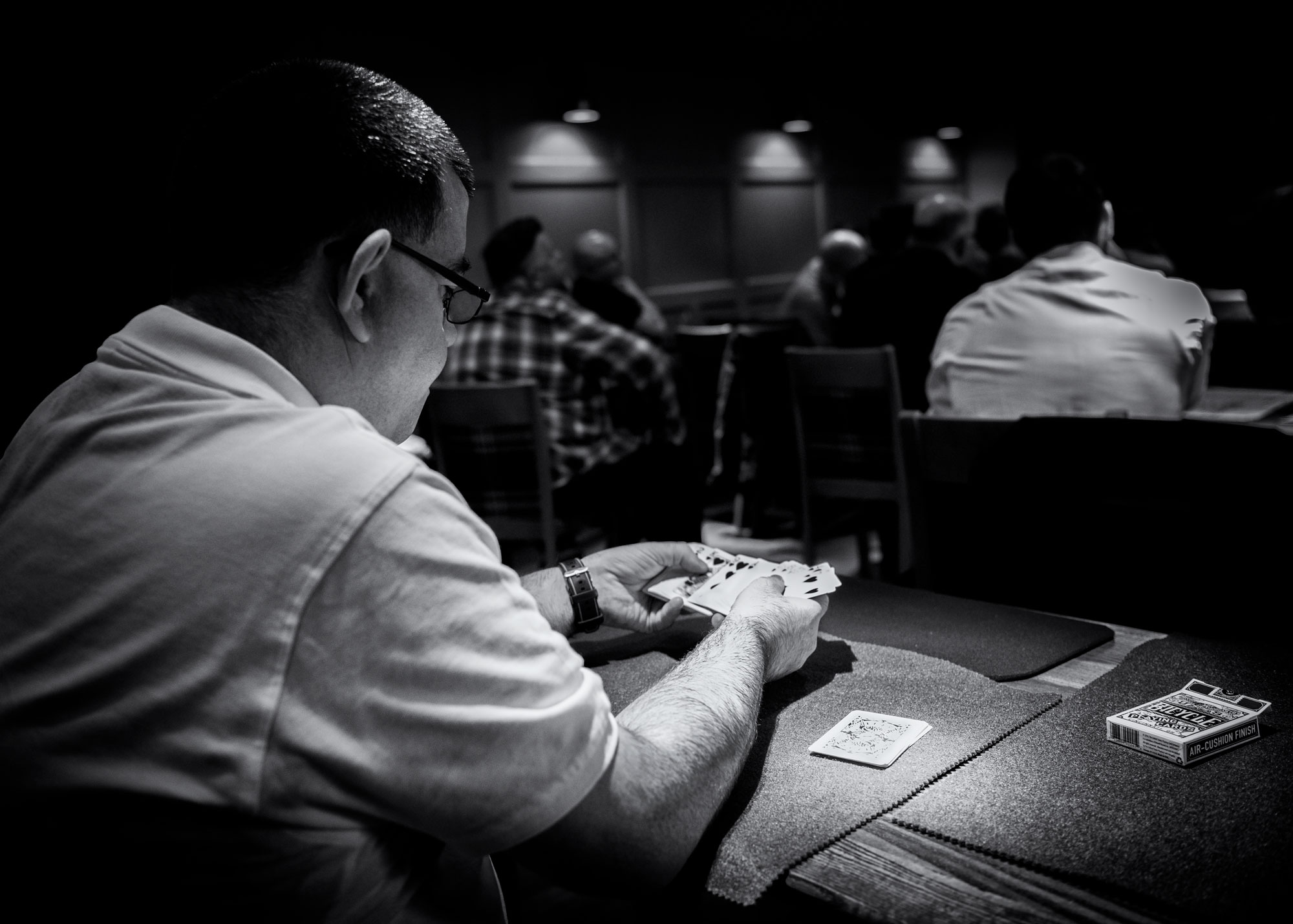 Peter McLanachan Prepares an effect with his cards.